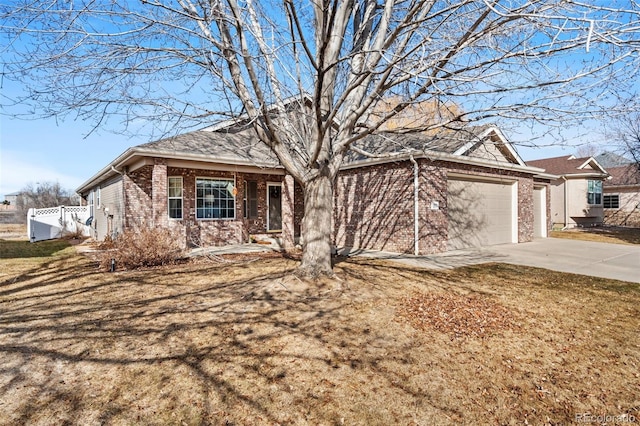 view of front of home featuring a garage and a front lawn