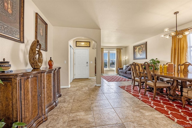 8004 Brittinger Way, Colorado Springs, CO 80951 - entrance foyer with arched walkways and a chandelier