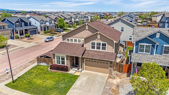 8004 Brittinger Way, Colorado Springs, CO 80951 - view of front facade with a residential view, stone siding, and driveway