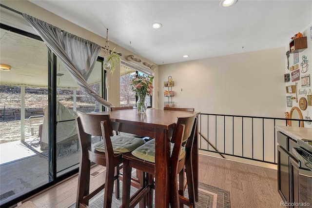 dining room featuring recessed lighting and light wood finished floors