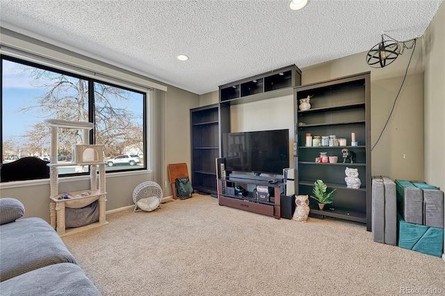 living area featuring carpet, baseboards, a textured ceiling, and recessed lighting