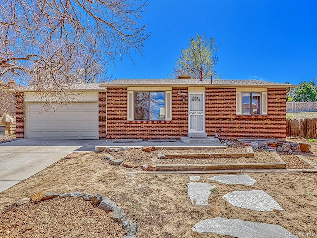 single story home with driveway, fence, brick siding, an attached garage, and a shingled roof
