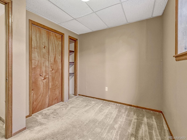 unfurnished bedroom with baseboards and carpet flooring