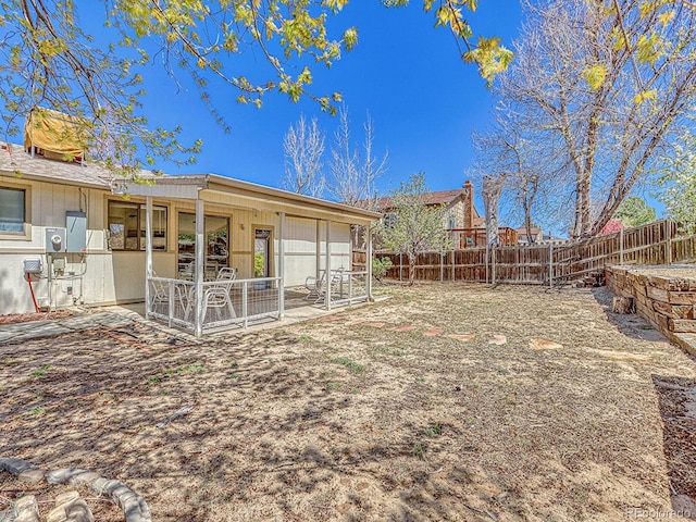 view of yard with a patio area and a fenced backyard