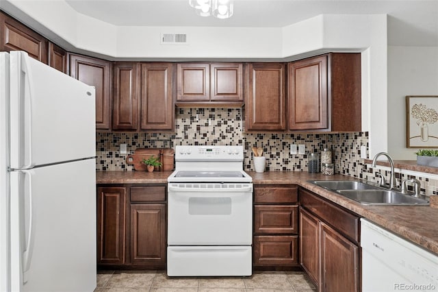 3300 W Florida Ave Unit 117, Denver, CO 80219 - kitchen featuring white appliances, a sink, backsplash, and light tile patterned floors