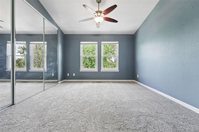3300 W Florida Ave Unit 117, Denver, CO 80219 - unfurnished bedroom with carpet floors, baseboards, a closet, and ceiling fan