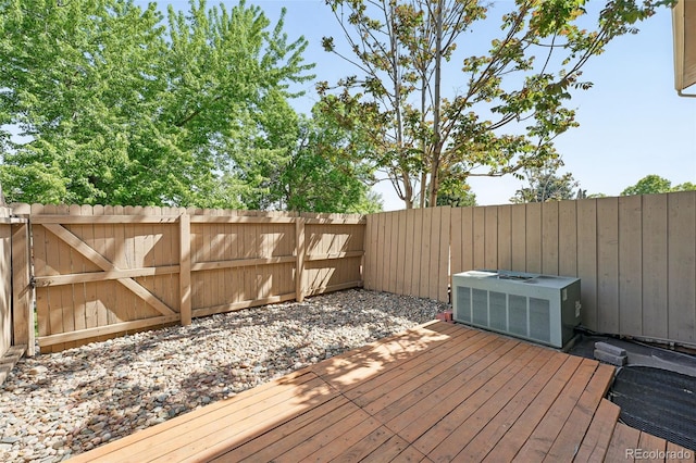 3300 W Florida Ave Unit 117, Denver, CO 80219 - wooden deck with a fenced backyard and central air condition unit