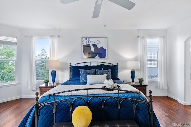 bedroom with ceiling fan and hardwood / wood-style flooring