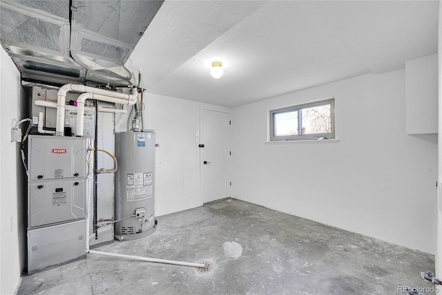 basement featuring gas water heater and heating unit