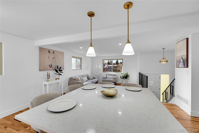 dining area with wood-type flooring