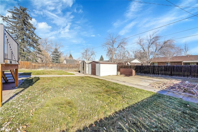 view of yard featuring a patio and a shed