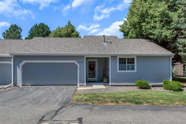 13701 E Marina Dr Unit B, Aurora, CO 80014 - ranch-style home featuring a garage, asphalt driveway, and a shingled roof