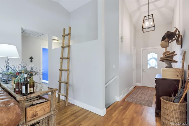 13701 E Marina Dr Unit B, Aurora, CO 80014 - foyer with wood finished floors and high vaulted ceiling