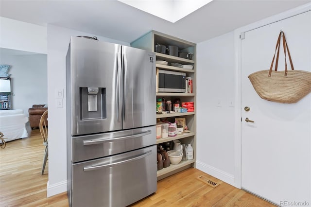 13701 E Marina Dr Unit B, Aurora, CO 80014 - kitchen featuring stainless steel appliances, light wood-style floors, and open shelves