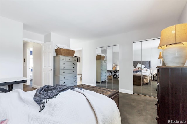 13701 E Marina Dr Unit B, Aurora, CO 80014 - bedroom featuring multiple closets and baseboards