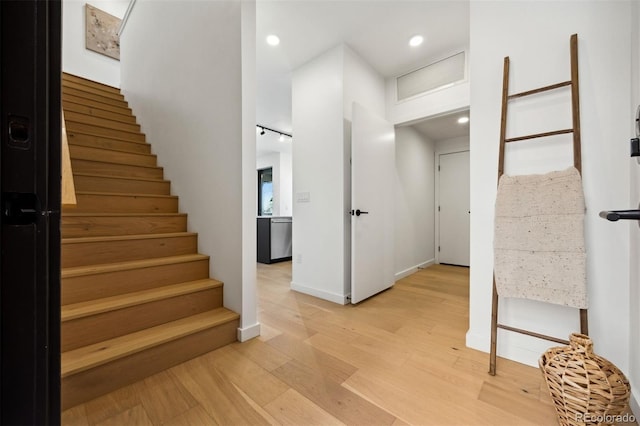 1601 Park Ave Unit 216, Denver, CO 80218 - stairs featuring wood finished floors, recessed lighting, and baseboards