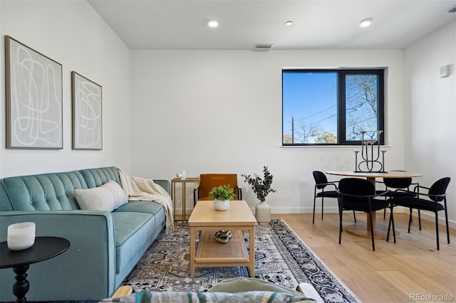 1601 Park Ave Unit 216, Denver, CO 80218 - living room with light wood finished floors, baseboards, and recessed lighting
