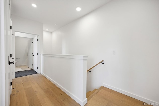 1601 Park Ave Unit 216, Denver, CO 80218 - corridor with an upstairs landing, light wood-style flooring, recessed lighting, and baseboards