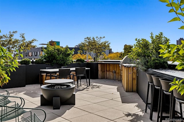 view of patio / terrace featuring an outdoor bar