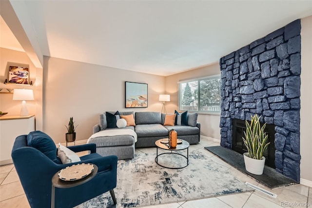 tiled living room featuring a fireplace