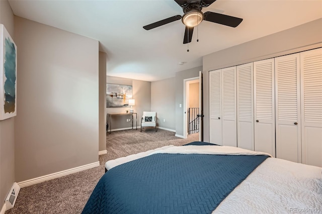 carpeted bedroom featuring ceiling fan and a closet