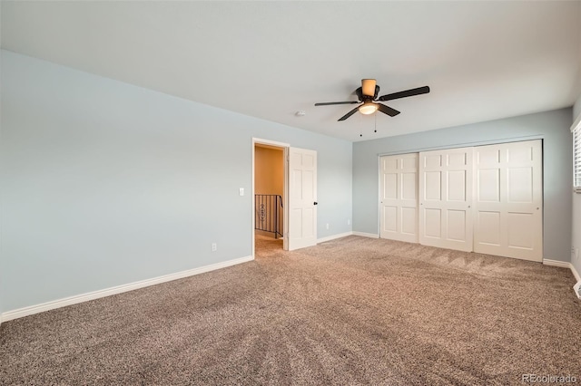 unfurnished bedroom featuring ceiling fan, carpet, and a closet