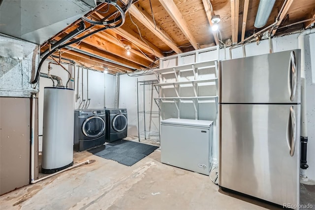 basement with separate washer and dryer, stainless steel fridge, refrigerator, and water heater