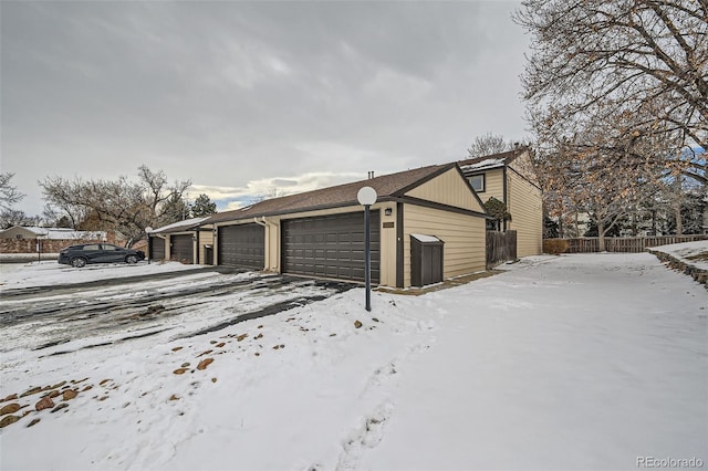 view of snow covered garage