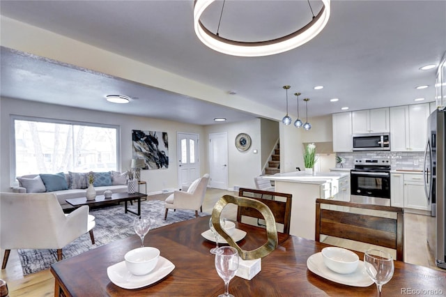 dining space featuring light hardwood / wood-style flooring