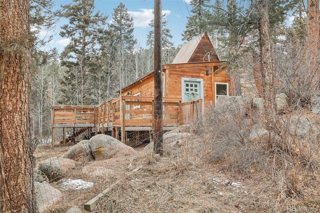 view of side of property featuring a deck