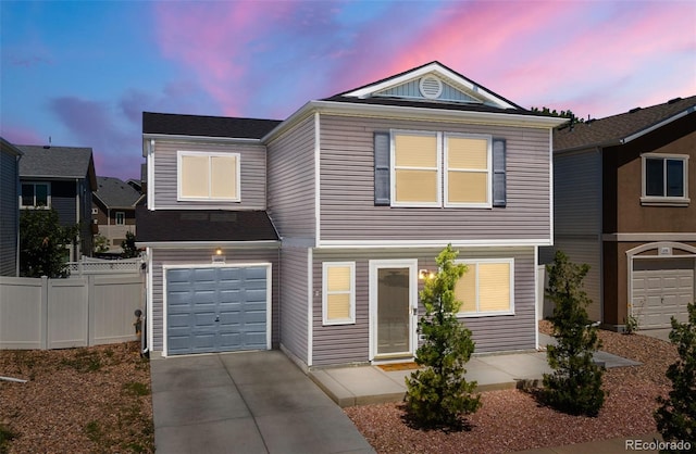 4695 Andes St, Denver, CO 80249 - view of front of property with concrete driveway and a garage