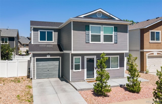 4695 Andes St, Denver, CO 80249 - view of front of property with concrete driveway and a garage
