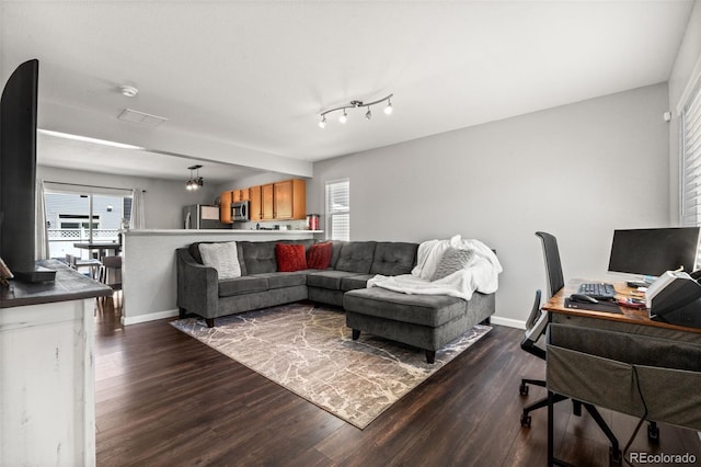 4695 Andes St, Denver, CO 80249 - living area featuring dark wood-type flooring and a desk