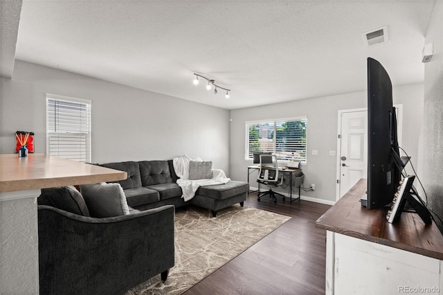 4695 Andes St, Denver, CO 80249 - living room with dark wood-style floors and baseboards