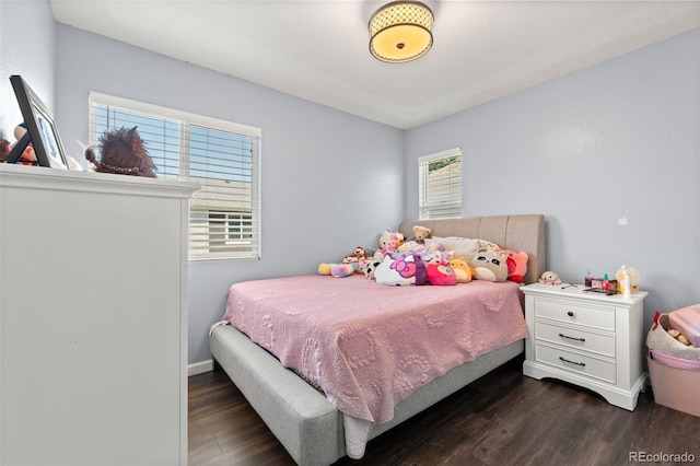 4695 Andes St, Denver, CO 80249 - bedroom featuring dark wood-type flooring and baseboards