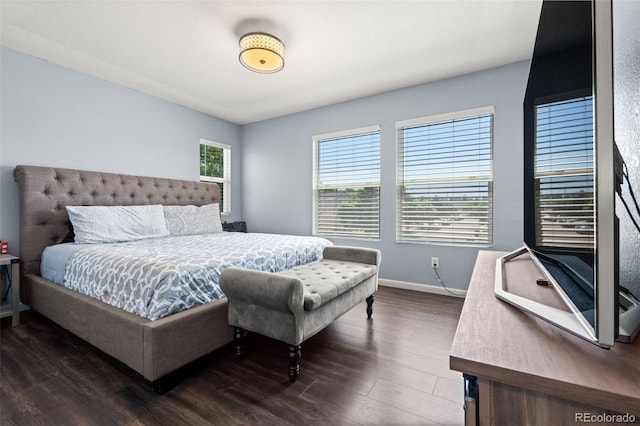 4695 Andes St, Denver, CO 80249 - bedroom featuring dark wood-type flooring and baseboards