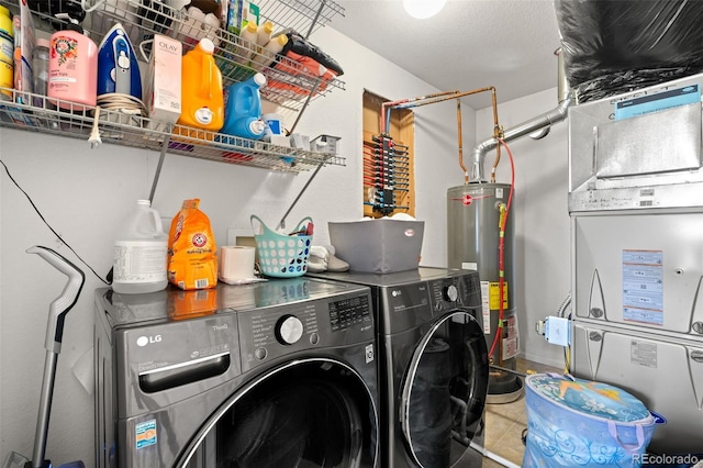 4695 Andes St, Denver, CO 80249 - washroom with washer and clothes dryer, gas water heater, heating unit, and tile patterned flooring
