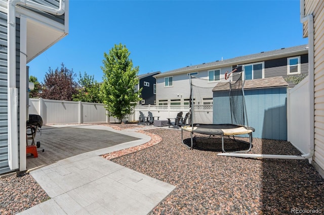 4695 Andes St, Denver, CO 80249 - fenced backyard featuring a patio, a shed, and a residential view