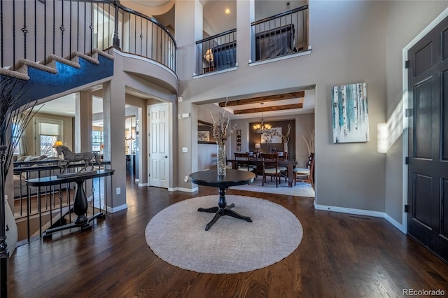 foyer featuring dark hardwood / wood-style floors and a chandelier