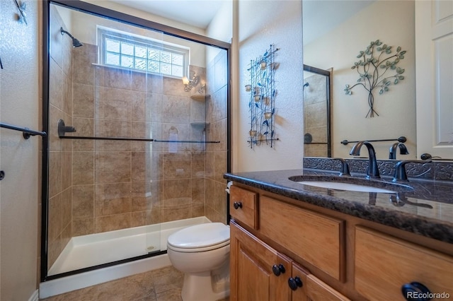 bathroom featuring walk in shower, tile patterned flooring, vanity, and toilet