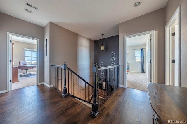 corridor with dark hardwood / wood-style floors