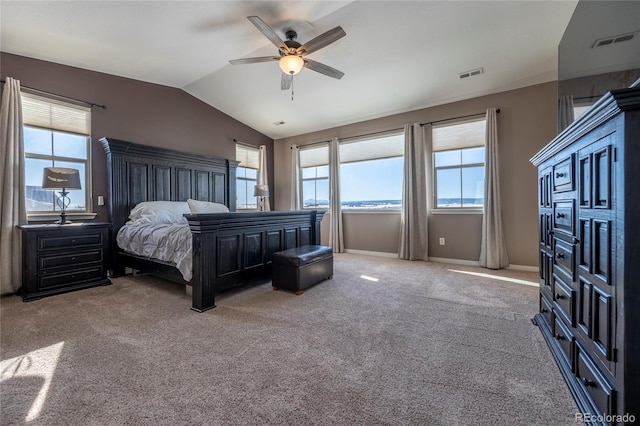 carpeted bedroom featuring ceiling fan and lofted ceiling