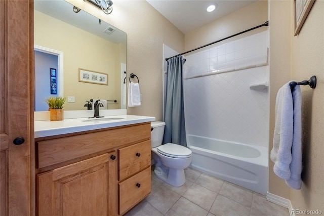 full bathroom featuring tile patterned floors, vanity, toilet, and shower / bath combo