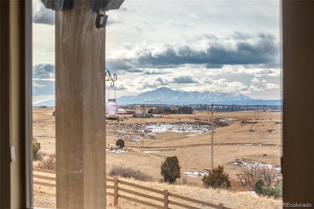 view of mountain feature with a rural view