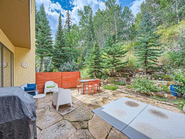 1370 Sandstone Dr Unit 12, Vail, CO 81657 - view of patio / terrace featuring outdoor dining space and a grill