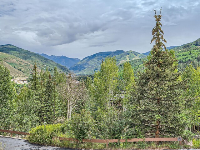 1370 Sandstone Dr Unit 12, Vail, CO 81657 - view of mountain backdrop featuring a forest