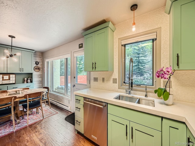 1370 Sandstone Dr Unit 12, Vail, CO 81657 - kitchen featuring stainless steel dishwasher, green cabinets, light countertops, baseboard heating, and a textured ceiling