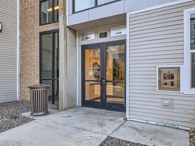 view of exterior entry featuring french doors