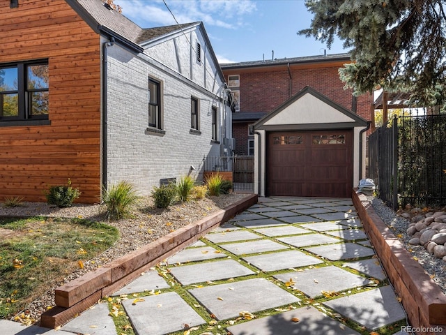 view of property exterior with a garage