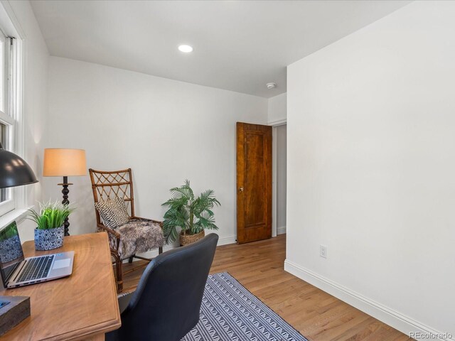 home office with light wood-type flooring